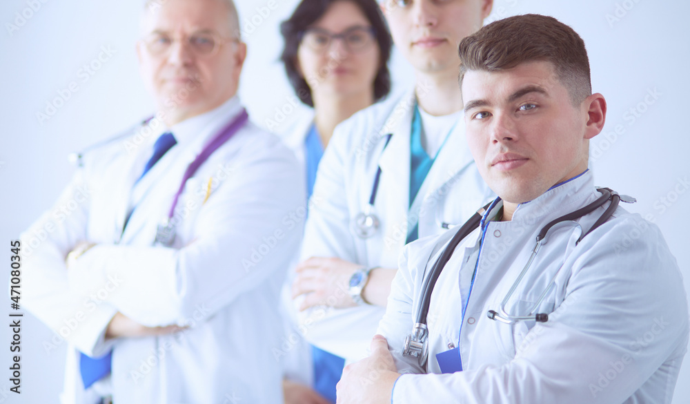 Successful medical team. Confident doctors team standing together and smiling Successful medical team. Confident doctors team standing together and smiling