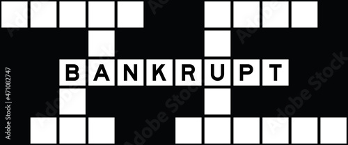 Alphabet letter in word bankrupt on crossword puzzle background