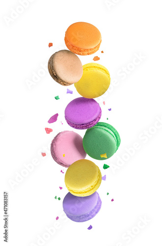 Colorful macaroons or macarons falling or flying over white background.