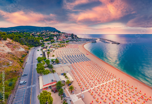 Fototapeta Naklejka Na Ścianę i Meble -  Aerial landscape photography. Colorful summer sunrise in Numana public beach. Picturesque seascape of Adriatic sea. Splendid outdoor scene of Italy, Europe. Traveling concept background.