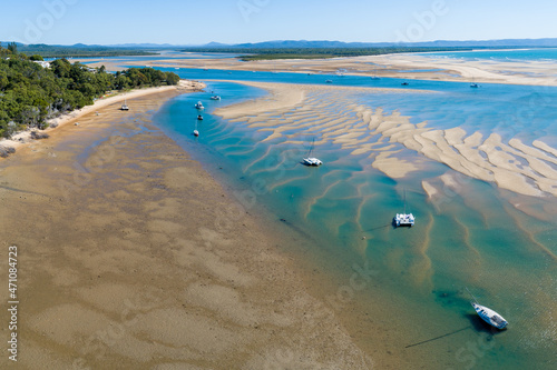 Aerial view of boats at anchor in an estuary at the Town of 1770, QLD. photo