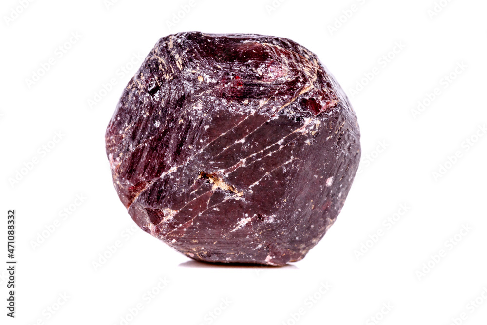 Macro of a mineral garnet stone on a white background Macro of a mineral garnet stone on a white background