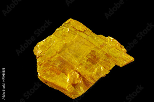 Macro stone Orpiment mineral on black background