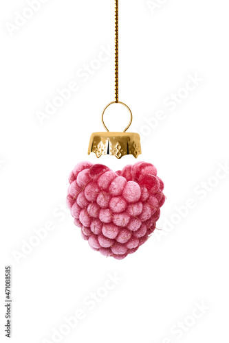 Christmas toy is made from frozen raspberries isolated on white background.
