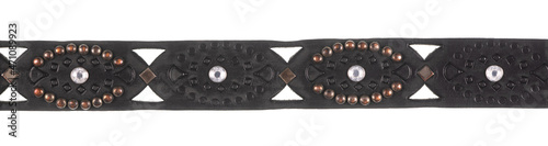 black leather belt with rivets isolated on white background photo