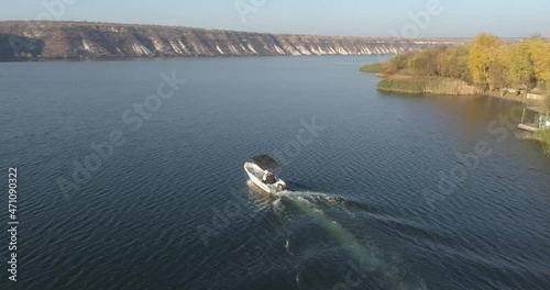 Aerial Drone View of Speed Boat Riding on the River into the Sunset