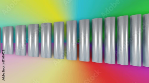 Silver metal bars on a rainbow gradient background. The bars are shortened from left to right. An abstract object composed of metal rods changes shape. photo