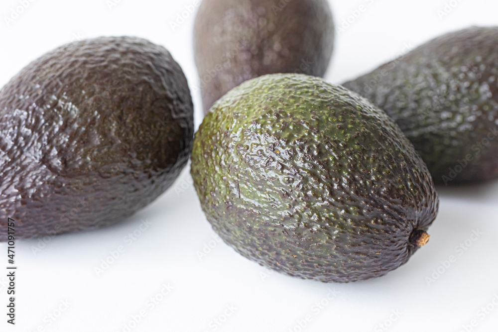 Fresh brown organic avocado on white background. Fresh brown organic avocado on white background.