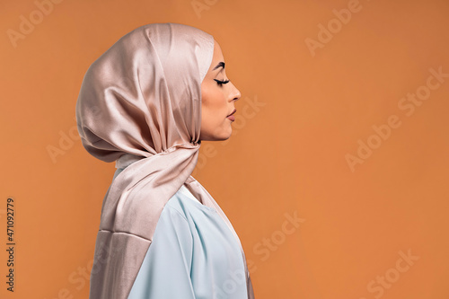 Side profile of young muslim woman