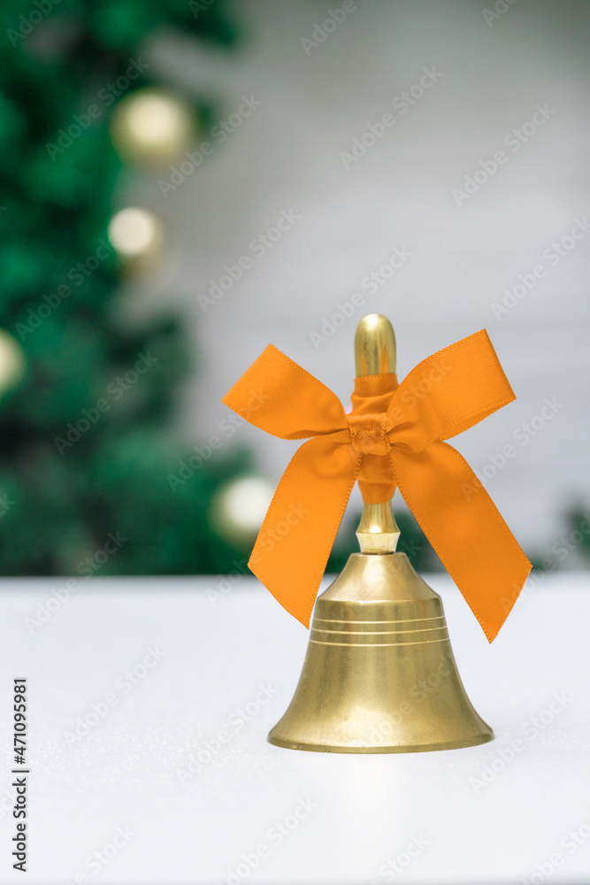 Gold bell yellow orange white background bow ribbon Christmas tree toy New Year