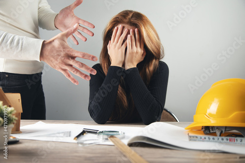 angry businessman with sad woman photo