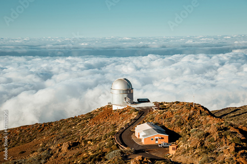 Telescope with dome on top of mountain
