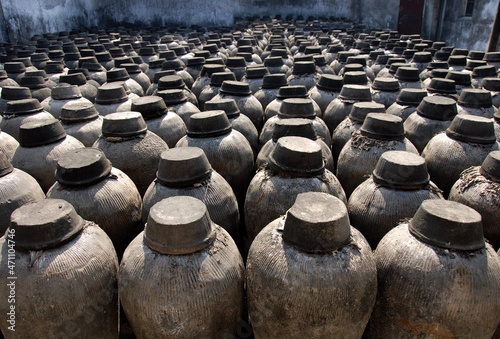 Wuzhen Water Town, Zhejiang Province, China. Jars used for fermenting rice wine. This is a traditional alcoholic drink manufactured in Wuzhen. photo