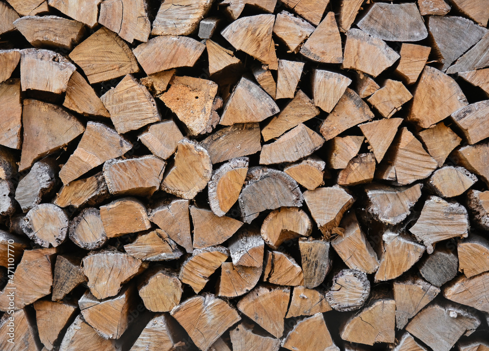 Stack pile of firewood oak wooden logs Stack pile of firewood oak wooden logs