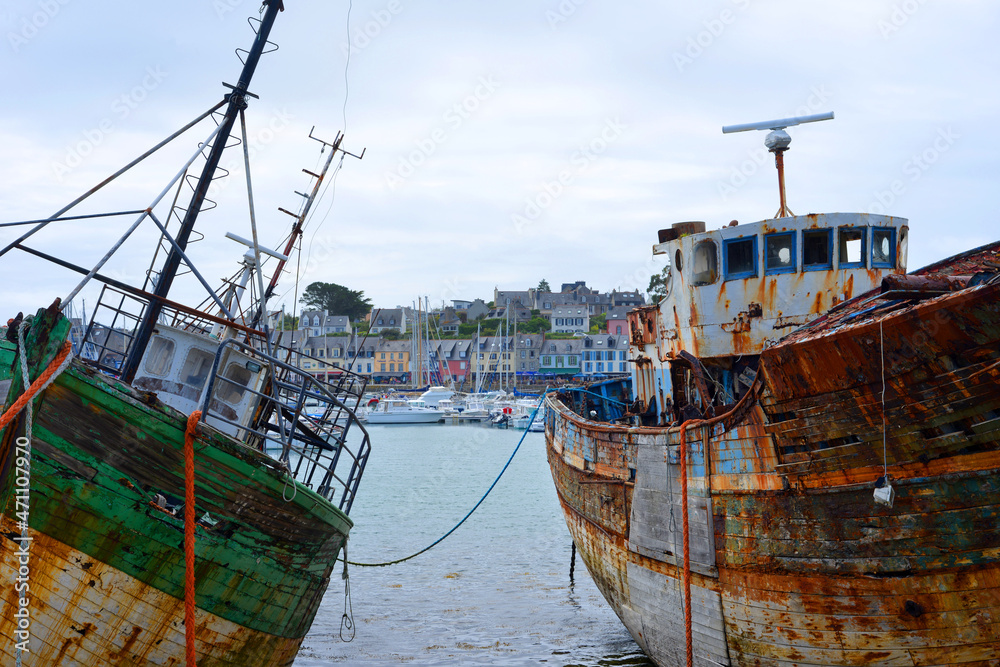 Camaret sur Mer, France, view to the village ancient fish trawlers rotting at the Harbor Camaret sur Mer, France, view to the village ancient fish trawlers rotting at the Harbor