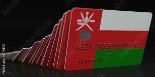 Domino effect, falling credit cards with flag of Oman, fictional data on card mockups. Financial crisis related 3d rendering photo