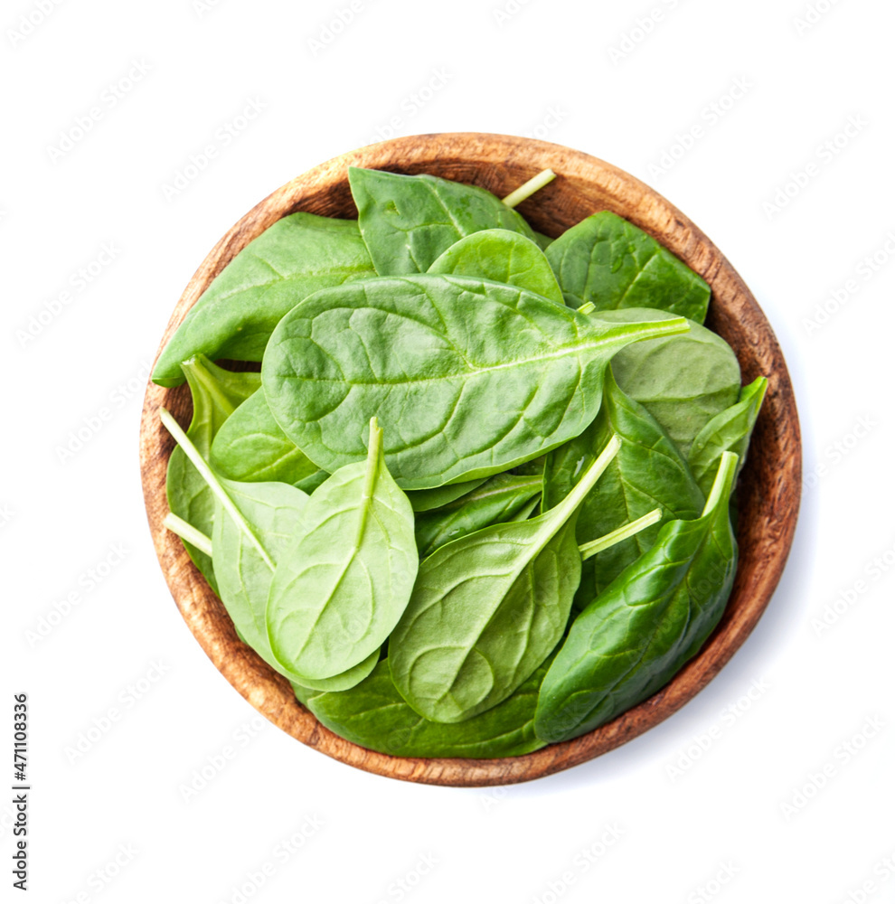 Spinach leaves in wooden plate Spinach leaves in wooden plate
