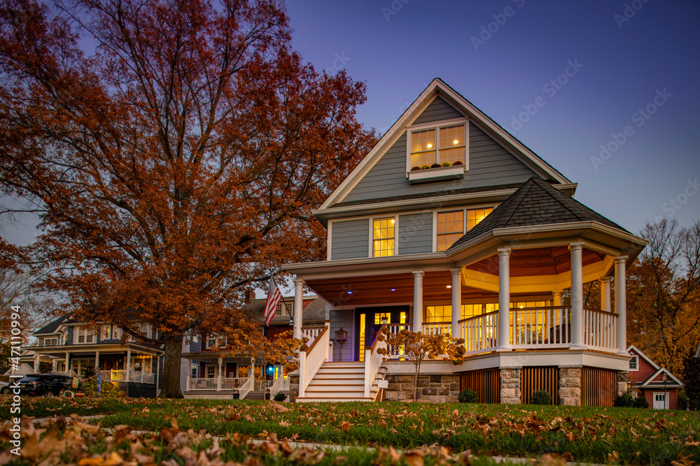 Autum scene of a Residential House at Twilight Autum scene of a Residential House at Twilight