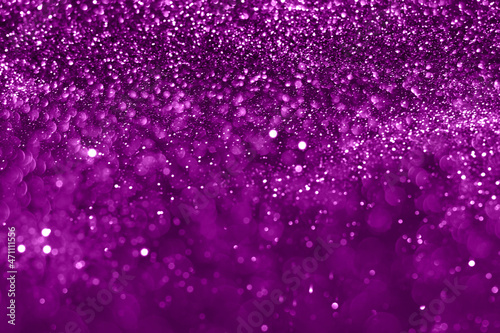 Velvet violet sparkling glitter background, christmas abstract shiny texture. Holiday lights