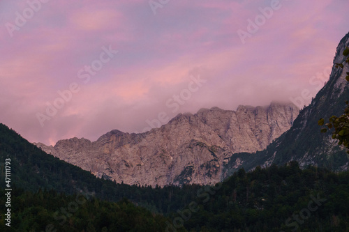 Red sunlight in the evening falling on rock formation of mountain in Julian Alps Triglav National Park  Slovenia