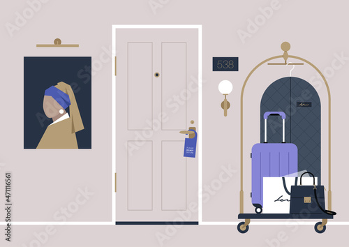 A hotel hallway, a do not disturb sign hanging on a doorknob, a baggage trolley