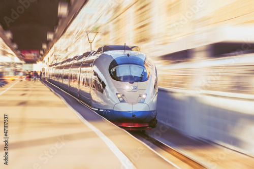 Record breaking fast passenger electric train sets off on a journey.