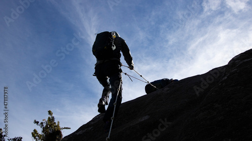 Person climbing in the mountain.
