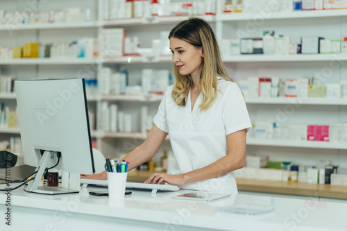 Portrait of a beautiful female pharmacist working in a pharmacy