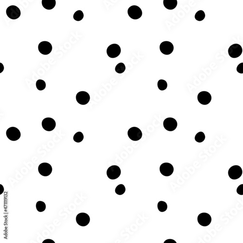 Seamless vector pattern in polka dots black on a white background