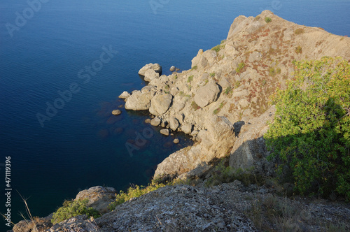 Morning on the Meganom mountain range, Eastern Crimea. he first rays of the sun illuminate the cape of the Meganom mountain range, part of the Karadag massif. Taken in the early morning photo