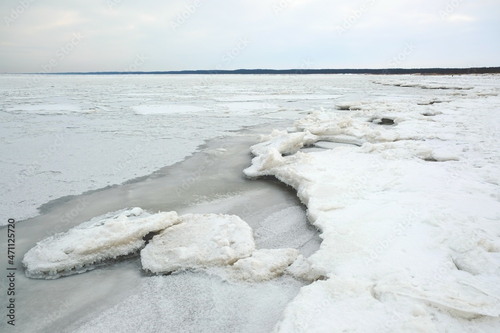 Winter seaside landscape - beach and frozen Baltic Sea near Mikoszewo, Zulawy Wislane, Poland Winter seaside landscape - beach and frozen Baltic Sea near Mikoszewo, Zulawy Wislane, Poland