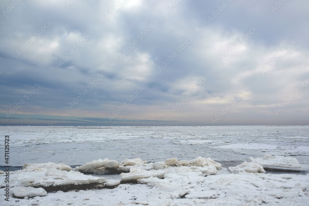 Winter seaside landscape - beach and frozen Baltic Sea near Mikoszewo, Zulawy Wislane, Poland Winter seaside landscape - beach and frozen Baltic Sea near Mikoszewo, Zulawy Wislane, Poland