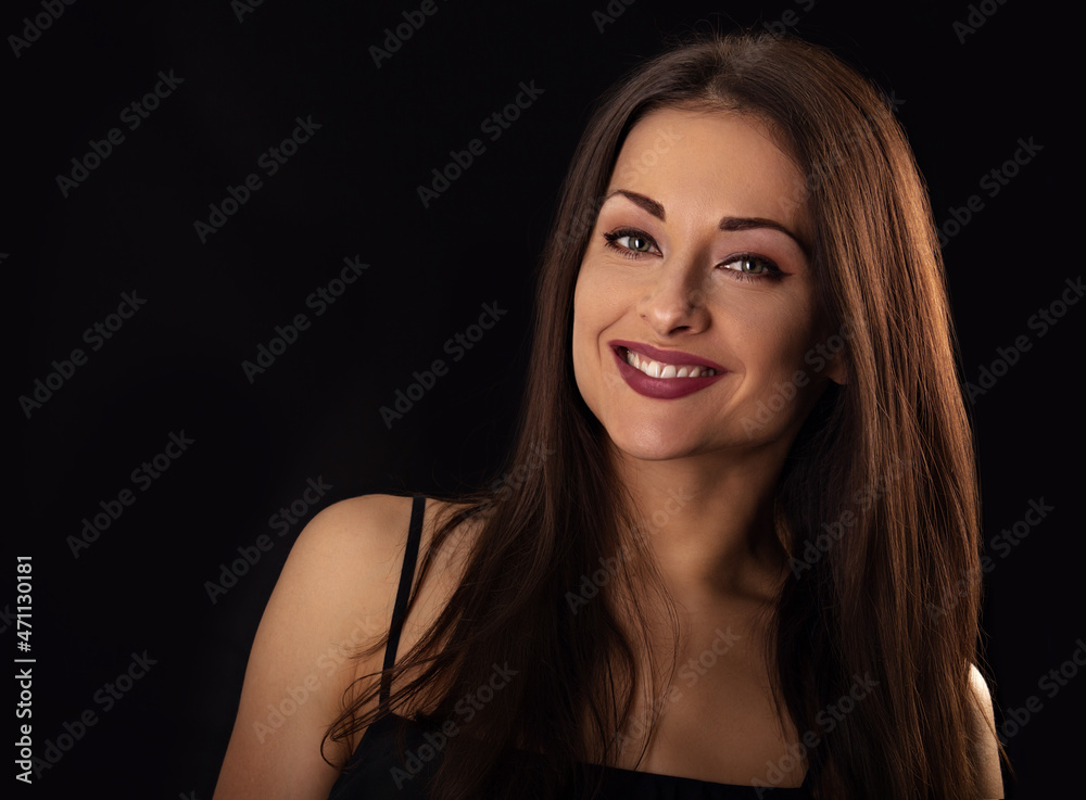 Beautiful makeup woman with long hair looking happy on black background. Closeup portrait Beautiful makeup woman with long hair looking happy on black background. Closeup portrait