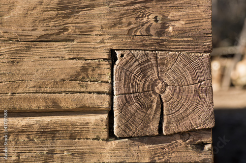 Tableau sur toile Square old pine log timber constructed house cabin corner dovetail joint closeup