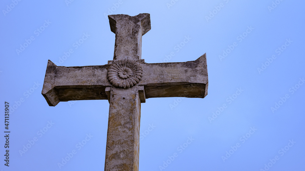 Stone cross with sky on the bottom. Catholic Religion