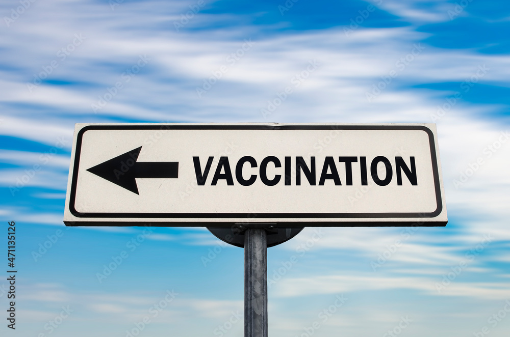 Vaccination road sign, arrow on blue sky background. One way blank road sign with copy space. Arrow on a pole pointing in one direction. Vaccination road sign, arrow on blue sky background. One way blank road sign with copy space. Arrow on a pole pointing in one direction.