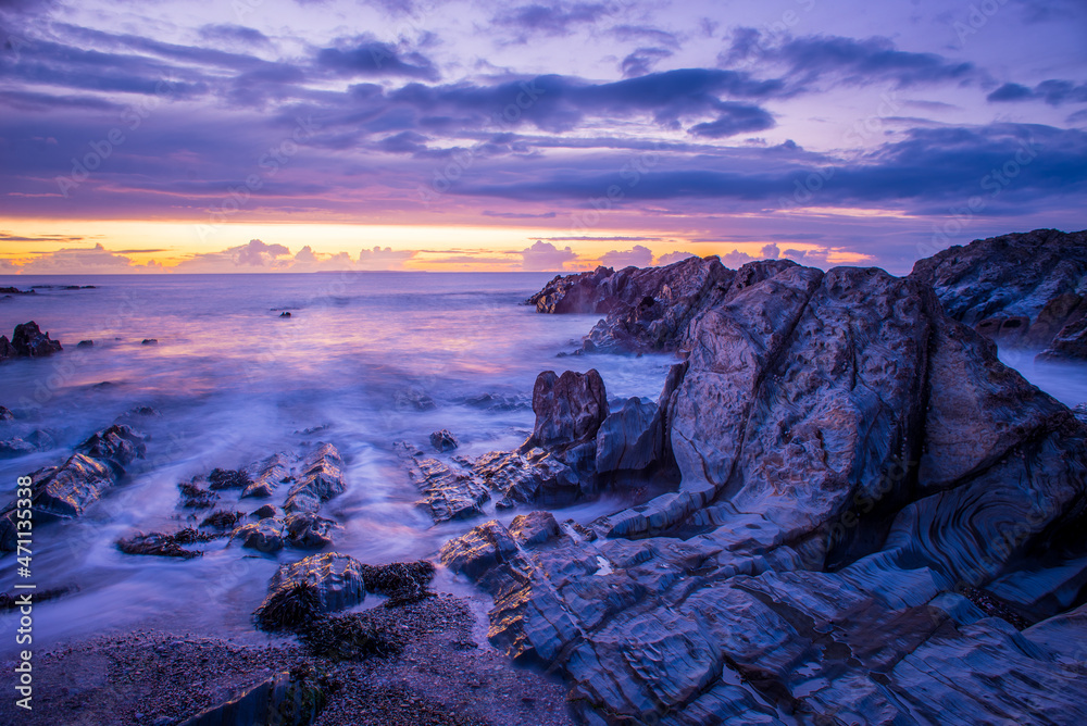 North Devon Sunset over Lundy Island and the low tide rocks at Woolacombe Beach North Devon Sunset over Lundy Island and the low tide rocks at Woolacombe Beach
