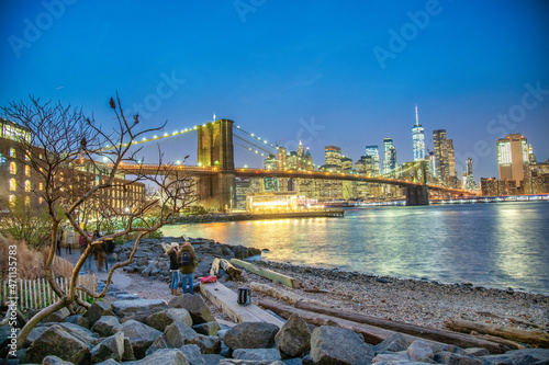 NEW YORK CITY - DECEMBER 6TH, 2018: Night view of Brooklyn Bridge and Lower Manhattan from Brooklyn district, New York City.