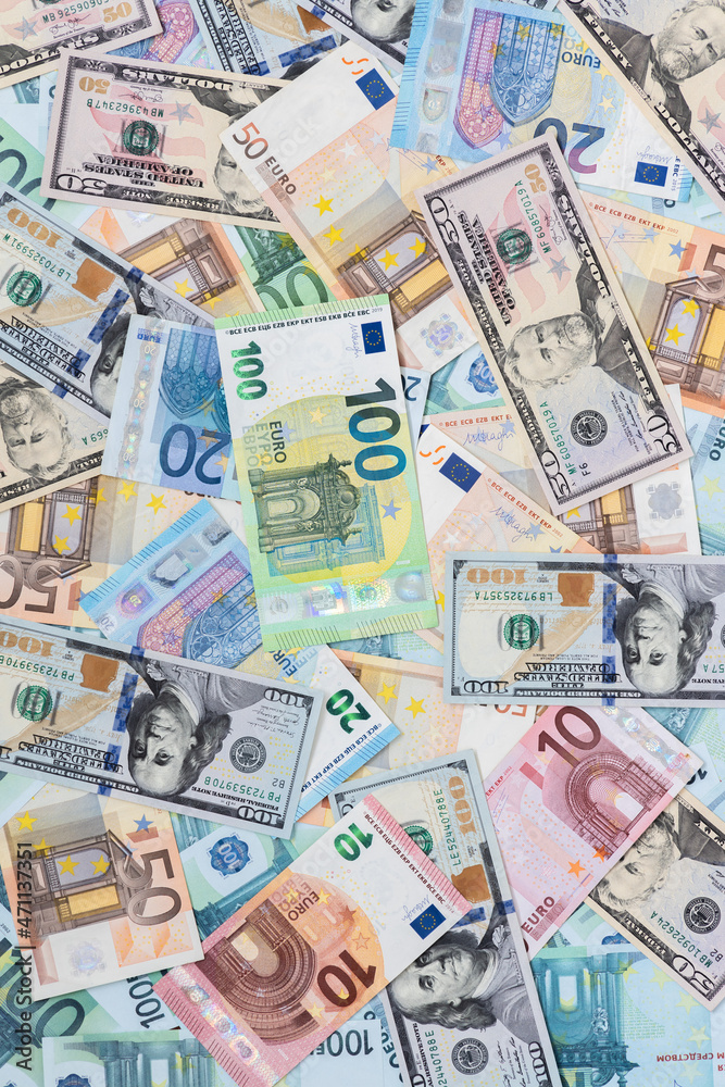 
Dollars and euros are laid out on the table in different bills