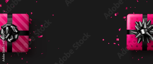Pink gift boxes with black bow.