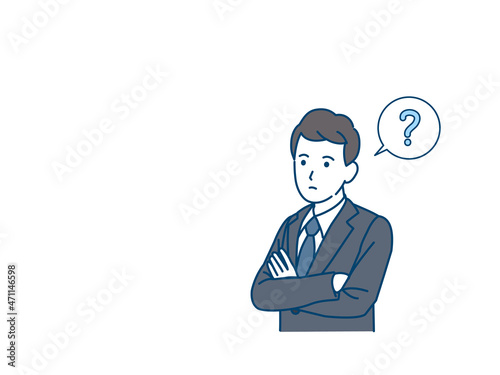 考え込む　考える　会社員　ビジネスマン　スーツ姿の男性　思考　疑問　腕を組む　？