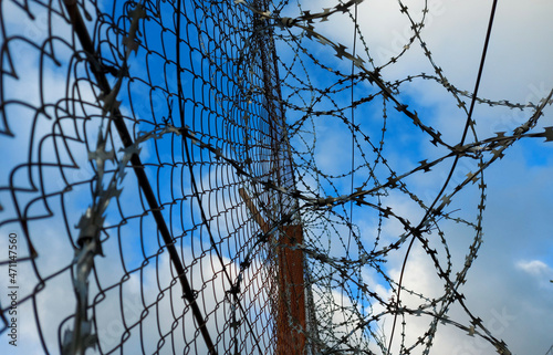 Barbed wire fence on the European border. Migration wave from the Middle East