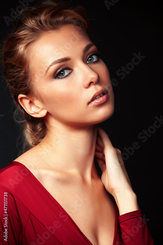 young sensual blond woman posing on black background  lifestyle people concept