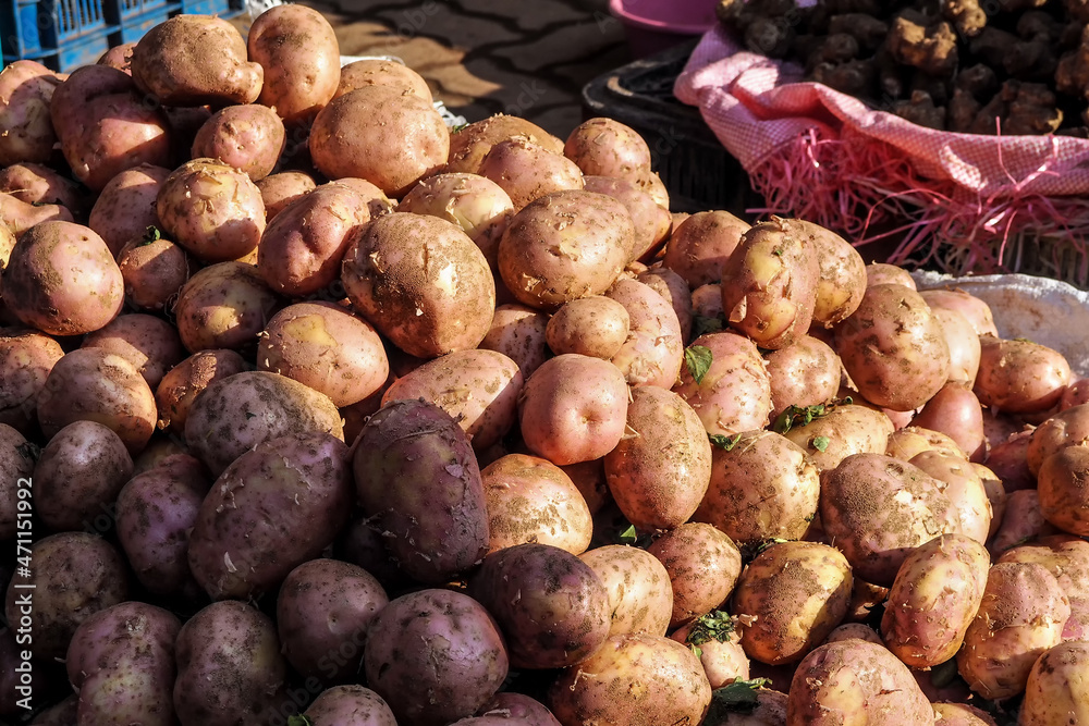 Sun shines on pile of potatoes displayed at street food market in Morocco Sun shines on pile of potatoes displayed at street food market in Morocco