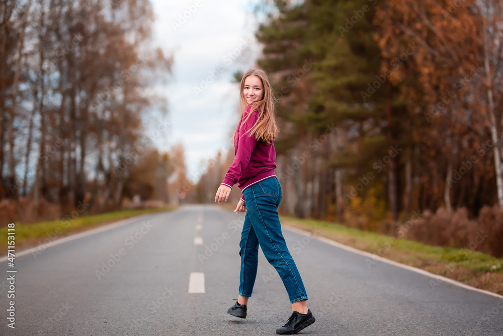Woman walking down empty road on the country side. Adventure, sport, exercise, freedom and movement. Woman walking down empty road on the country side. Adventure, sport, exercise, freedom and movement.
