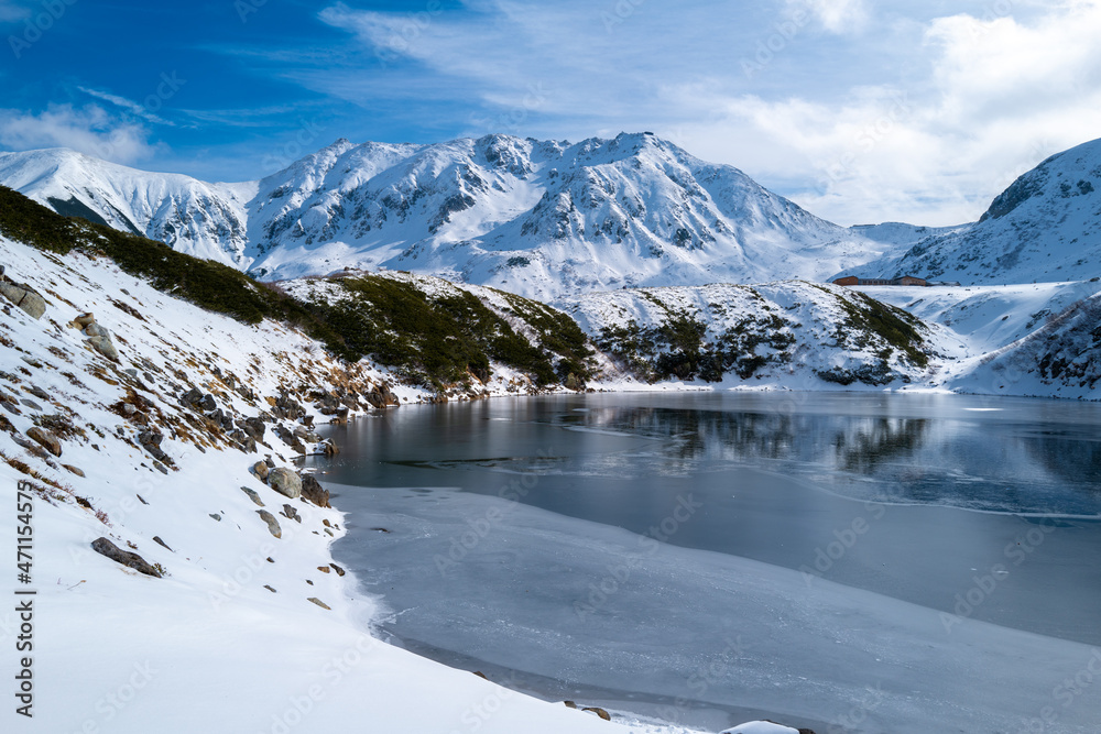 富山県立山町にある立山の冬の雪景色のある風景 Landscape with snowy winter scenery of Tateyama in Tateyama Town, Toyama Prefecture, Japan.