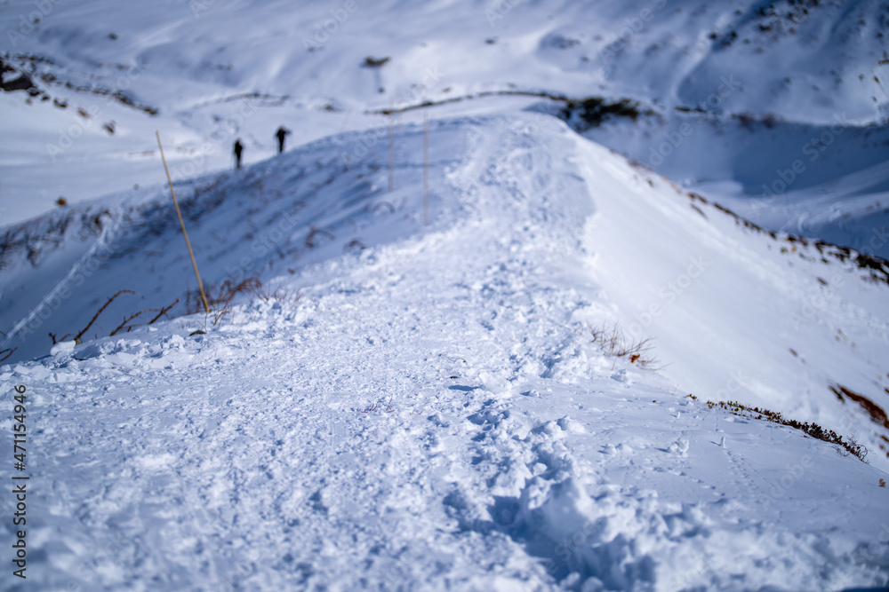 富山県立山町にある立山の冬の雪景色のある風景 Landscape with snowy winter scenery of Tateyama in Tateyama Town, Toyama Prefecture, Japan.