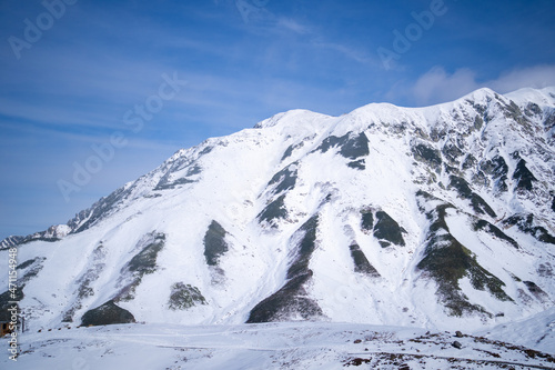 富山県立山町にある立山の冬の雪景色のある風景 Landscape with snowy winter scenery of Tateyama in Tateyama Town, Toyama Prefecture, Japan. photo