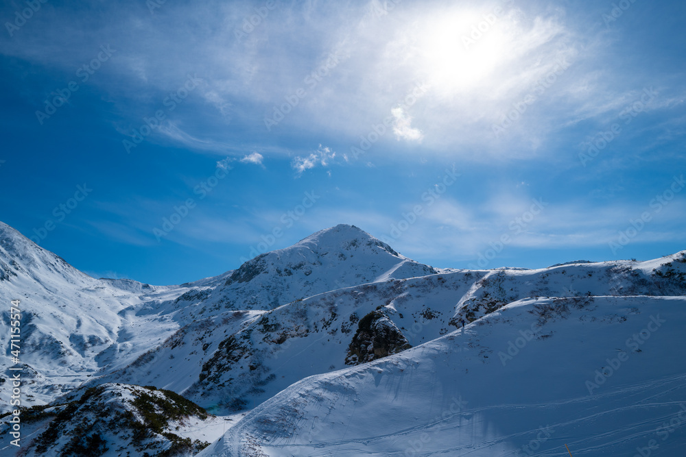 富山県立山町にある立山の冬の雪景色のある風景 Landscape with snowy winter scenery of Tateyama in Tateyama Town, Toyama Prefecture, Japan.