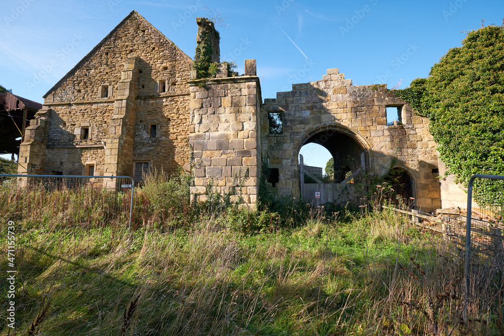Main entrance to a ruined old manor house in South Wingfield, Derbyshire, UK